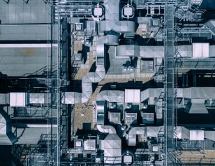 Air Condition Ventilation System on the Building Roof. Industrial Air system of ventilation and Air conditioning. Aerial Shot.